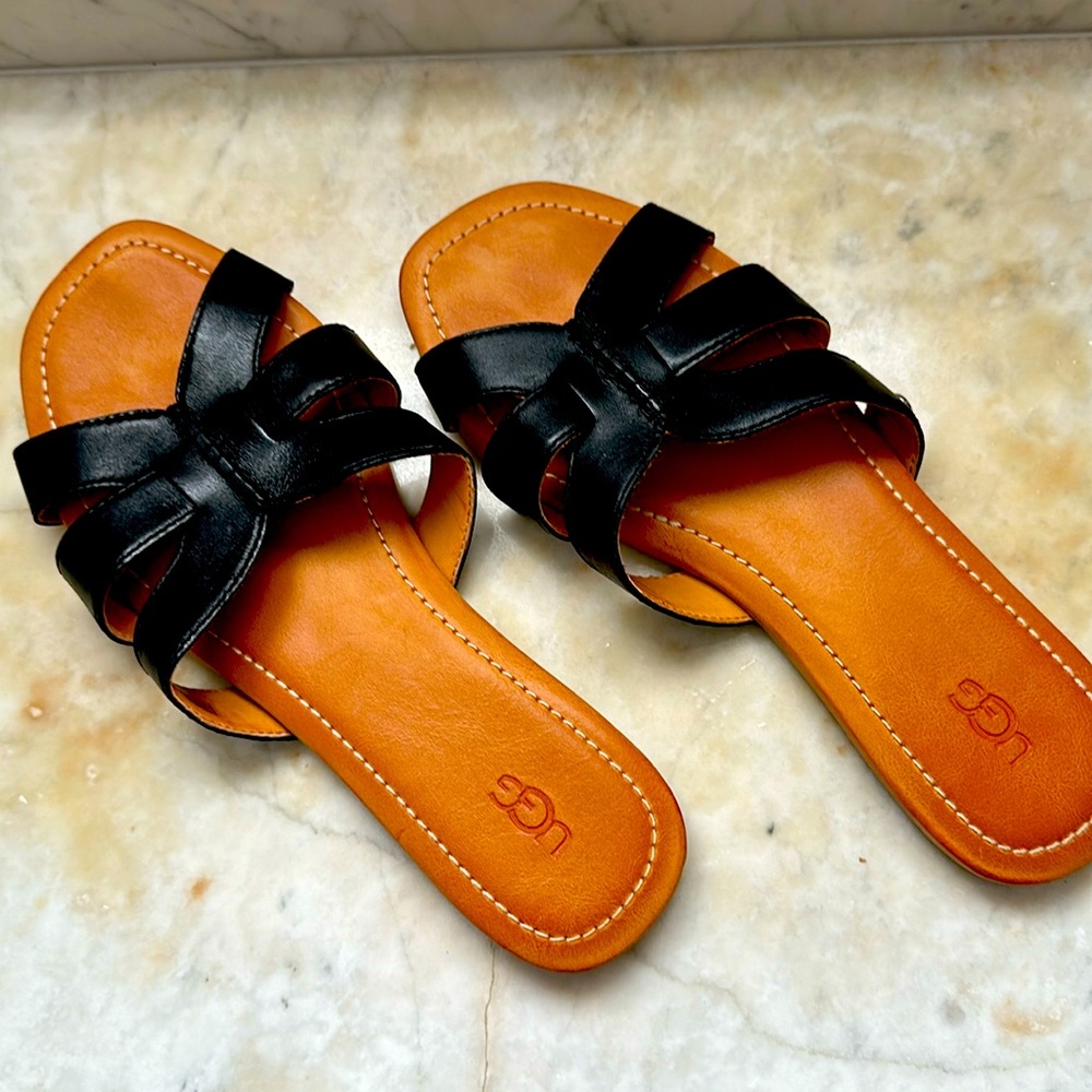 Black and tan Ugg slides
